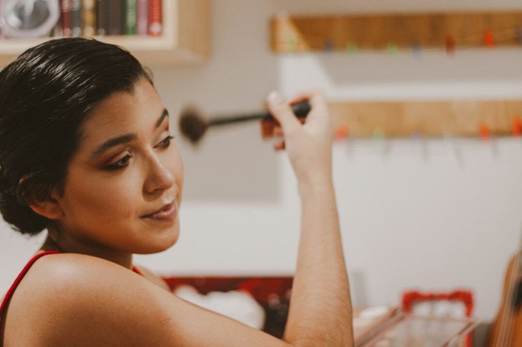 Woman writing on a whiteboard during a workshop discussion